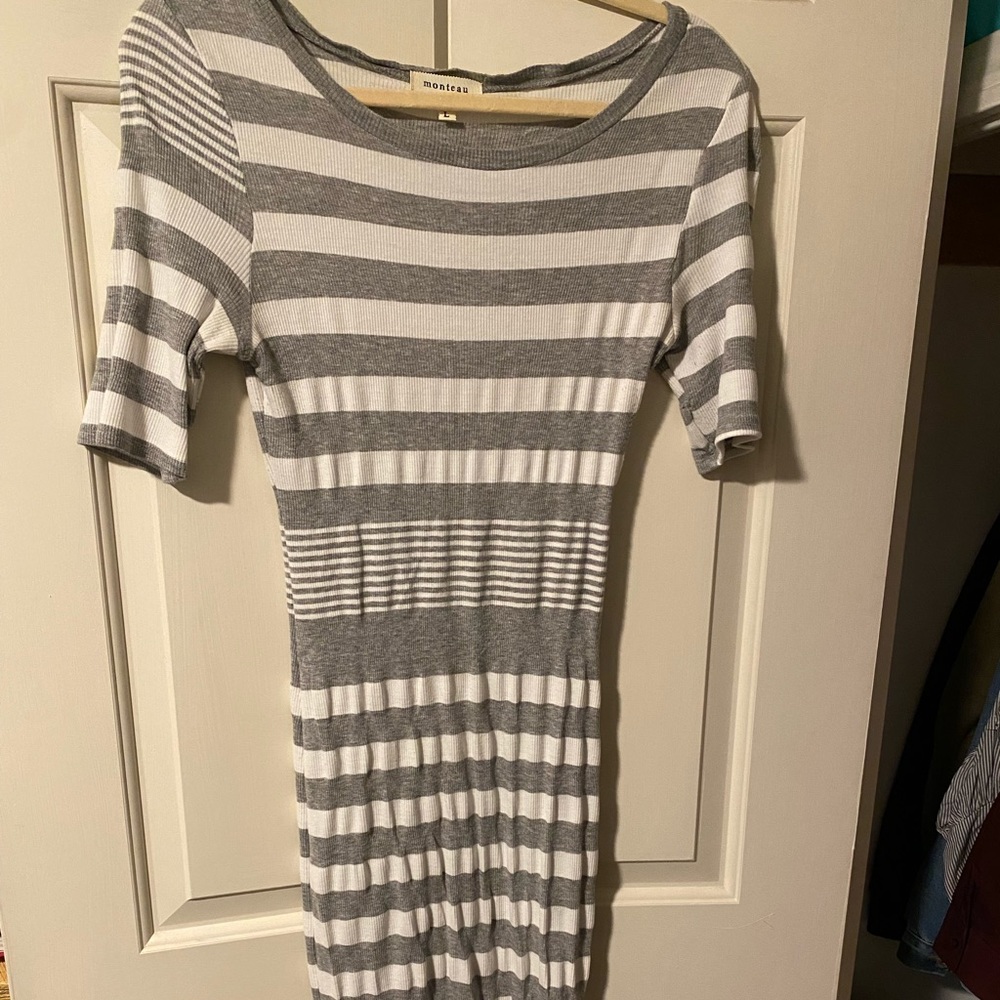This striped, midi monteau dress with a slit is stylish and comfortable.